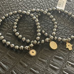 Three Stretch Beaded Bracelets with Charms Hanging
